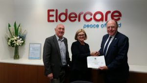 CommonAge CEO Klaus Zimmermann and Chairman Andrew Larpent present Eldercare CEO Jane Pickering with its Founding Member certificate.